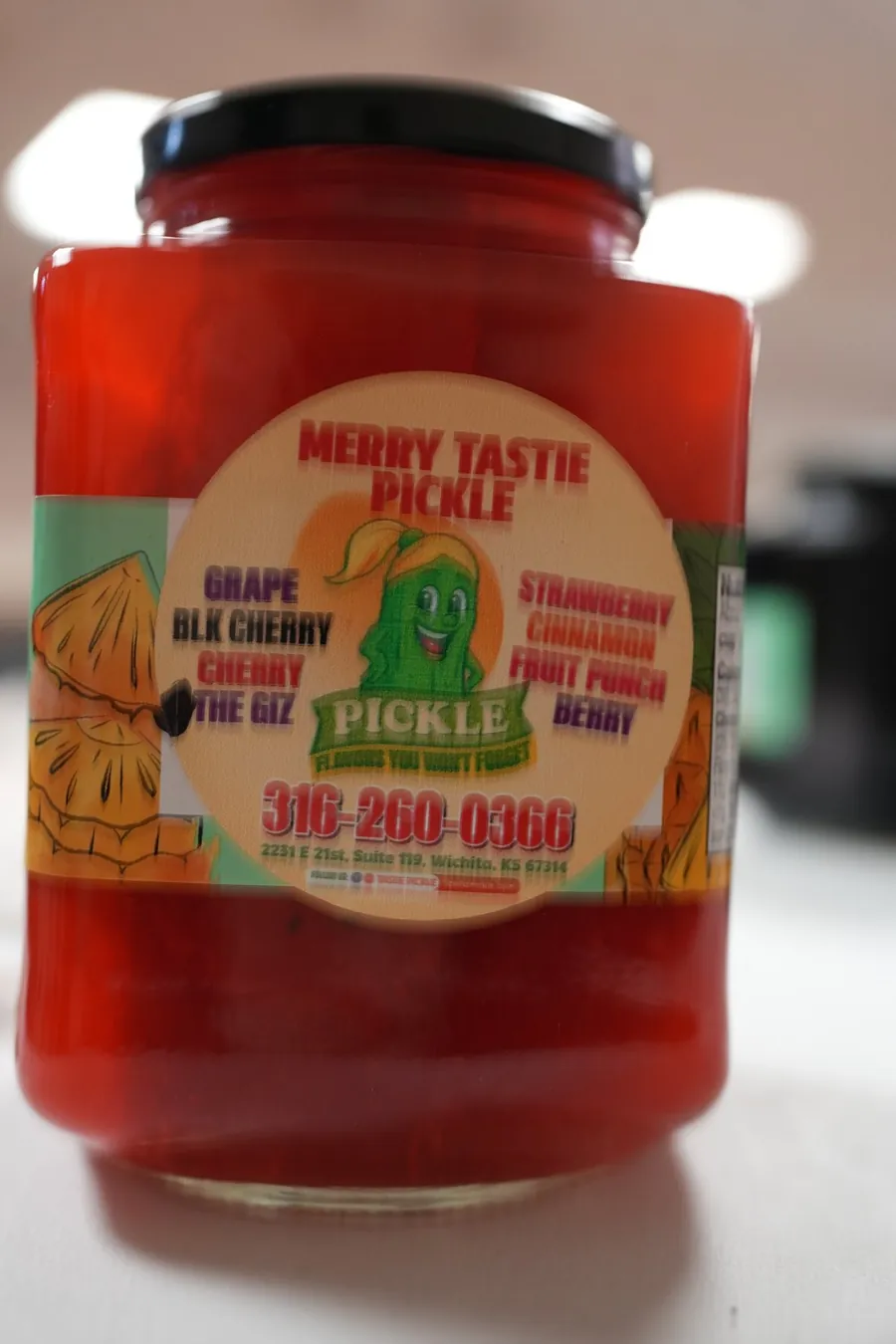 Red flavored pickle jar from Miss Merry's Tastie Pickles in Wichita